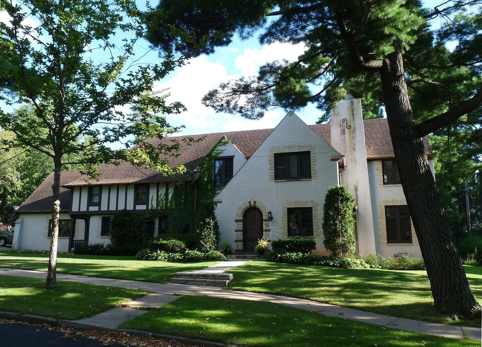 A Tudor Revival home with white stucco and dark half-timbering in Wausau
